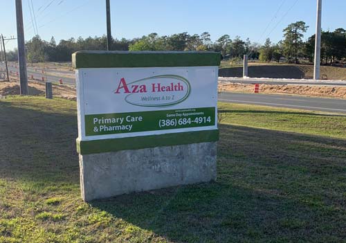 Image shows the street sign at the entrance of Aza Health at 1213 State Road 20, Interlachen, Florida.