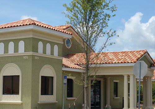Image shows the exterior and entrance canopy for Aza Health medical location in St Augustine at 105 Whitehall Drive, Suite 109, St Augustine Florida 32086.