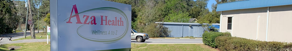 Image shows the street sign from the 71st Avenue approach as well as a portion of the exterior of the Aza Health building at 22066 SE 71st Avenue, Hawthorne, Florida.